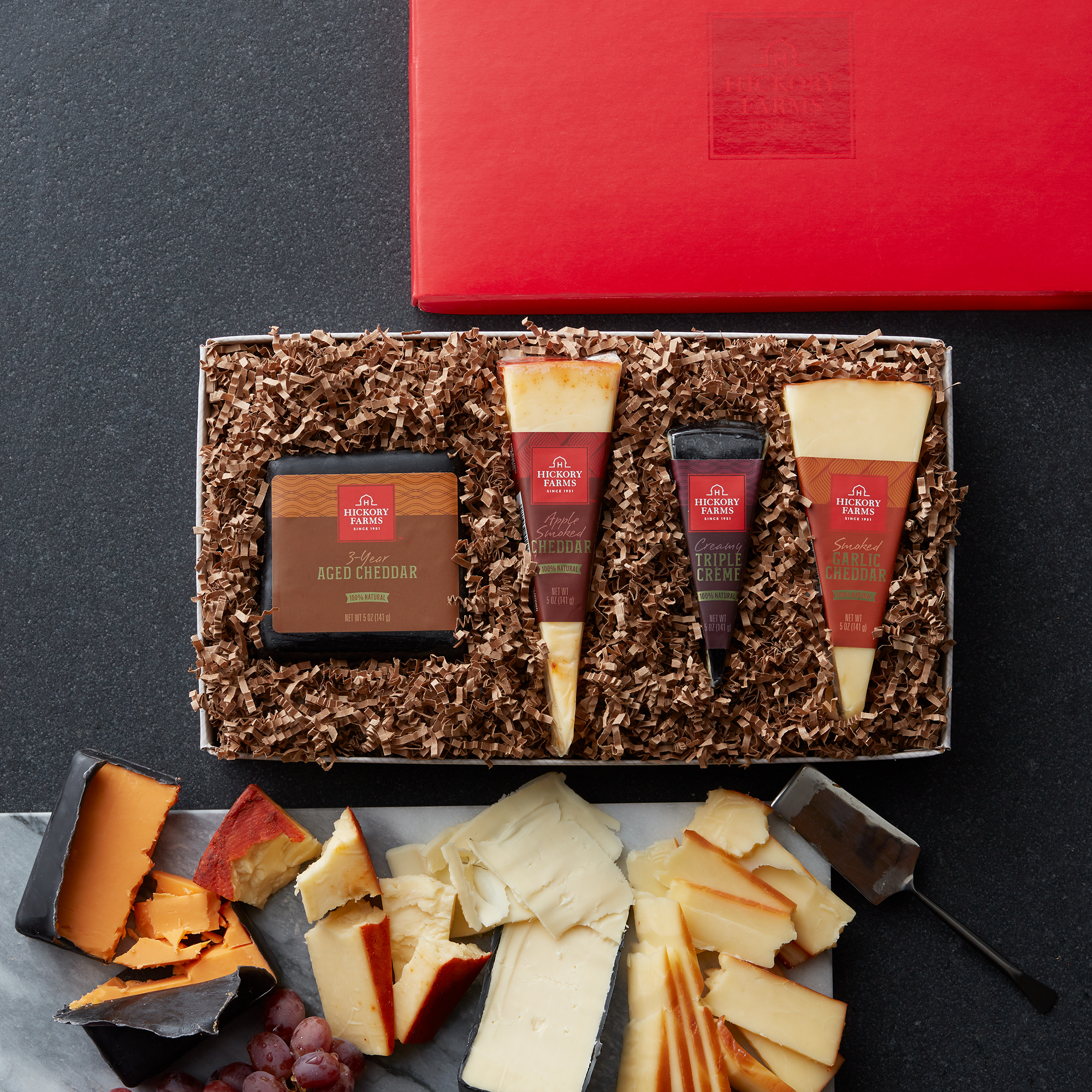 Gourmet cheese flight includes apple smoked cheddar, smoked garlic cheddar, 3 year aged cheddar, and tripe creme